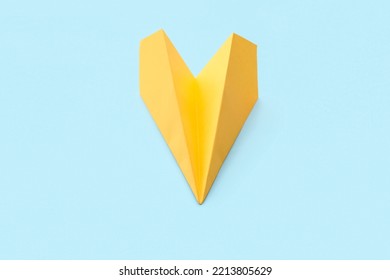 Yellow Paper Plane On Blue Background