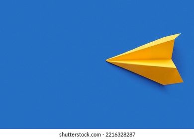 Yellow Paper Plane On Blue Background