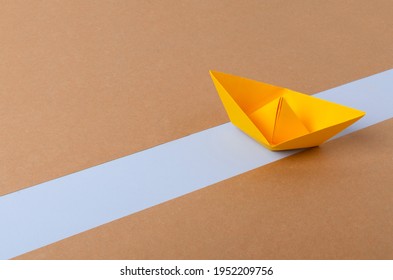 Yellow Paper Ship On The Blue Way.Abstract Idea Of Blocked Suez Canal