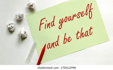 yellow paper with text "Find yourself and be that?" on the white with red marker