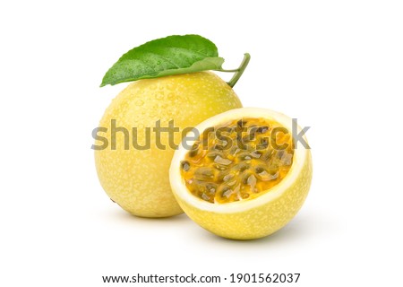Yellow  passion fruit with cut in half and green leaf isolated on white background.
 Clipping path.
