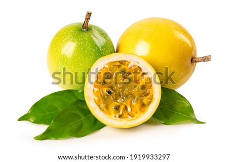 Yellow passion fruits with green leaves isolated on white background.