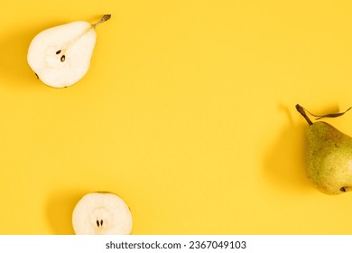Yellow pears pattern. Close up of pear on yellow background. Autumn fruit concept from ripe juicy pears. Flat lay, top view