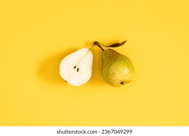 Yellow pears pattern. Close up of pear on yellow background. Autumn fruit concept from ripe juicy pears. Flat lay, top view