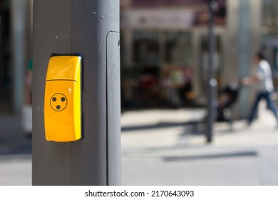 Yellow pedestrian traffic light button. Crosswalk button for traffic light