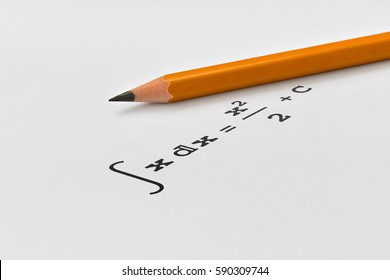 Yellow pencil and integral of a function on bright background