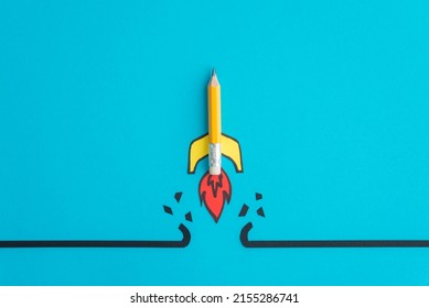 Yellow pencil rocket breaking through black wall obstacle on blue background minimal style. Concept of breakthrough for new idea, innovative and successful goal in business financial.