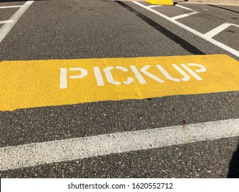 Yellow Pickup Sign In Store Parking Lot Used For Customers Picking Up Orders