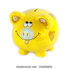 Yellow piggy bank style money box isolated on a white - Shutterstock ID 312056810