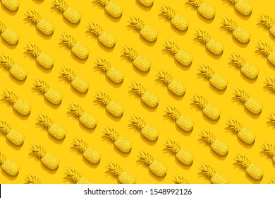 Yellow pineapple on a yellow background. Pattern