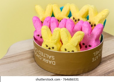 Yellow And Pink Peeps On A Cutting Board.