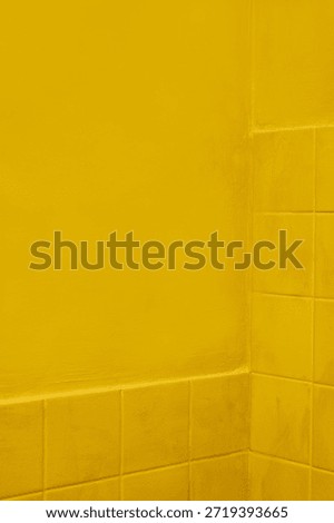 Yellow plaster wall corner with smooth surface, subtle imperfections and natural light falloff. Minimal architectural background with calm geometry and balanced negative space. Copy space