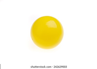 Yellow plastic ball on white background