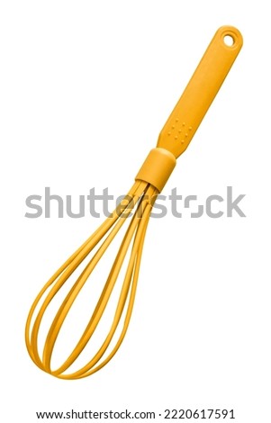 Yellow plastic balloon whisk isolated on white background