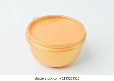 Yellow plastic bowl isolated on a white background