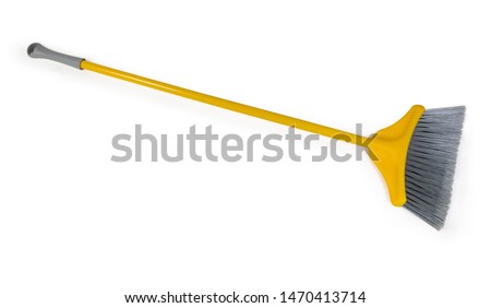 Yellow plastic broom with gray bristles for sweeping floors on a white background
