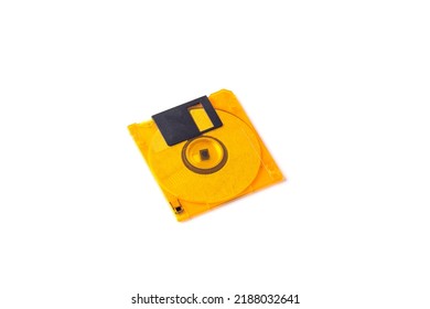 Yellow Plastic Floppy Disk On A White Background.