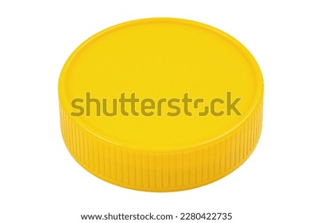 Yellow plastic lid isolated on white background. Plastic round jar lid. File contains clipping path.