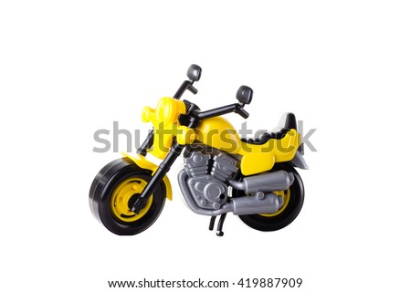 Yellow plastic motorbike toy isolated on white background