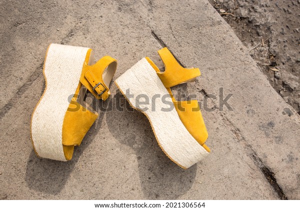 Yellow platform shoes in the\
street
