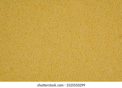 Yellow Polyurethane Foam Rubber Pieces Background Texture. Stuffing For Pillows And Furniture