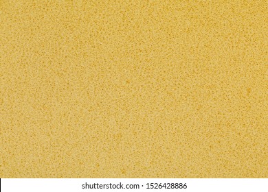 Yellow Polyurethane Foam Rubber Pieces Background Texture. Stuffing For Pillows And Furniture