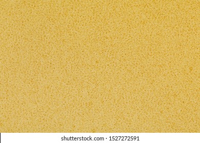 Yellow Polyurethane Foam Rubber Pieces Background Texture. Stuffing For Pillows And Furniture