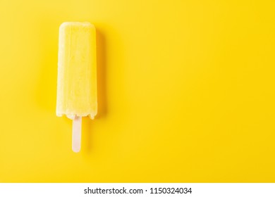 Yellow Popsicle On A Yellow Background