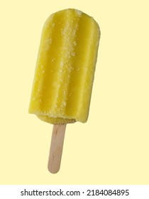 Yellow Popsicle Or Stick Creamy Ice Cream With Light Yellow Background. Unwrapped. Ready To Ease. Corn Or Jagung Flavor. Frost Bite. Happiness Concept. Wooden Stick. Malaysia. 