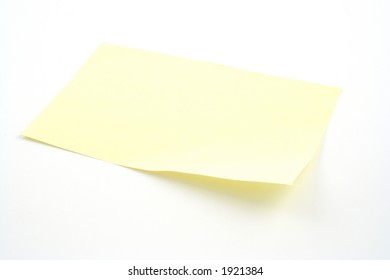 Yellow post It note on white background - Powered by Shutterstock - Get 15% off with code: PIKWIZARD15