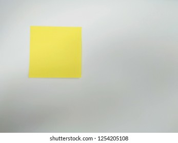 Yellow post It note on withe background, ready for your message. - Powered by Shutterstock - Get 15% off with code: PIKWIZARD15