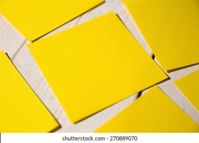 Yellow Post Its On Wooden Backround