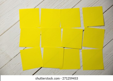 Yellow Post Its On Wooden Backround