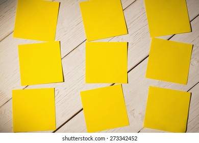 Yellow Post Its On Wooden Backround