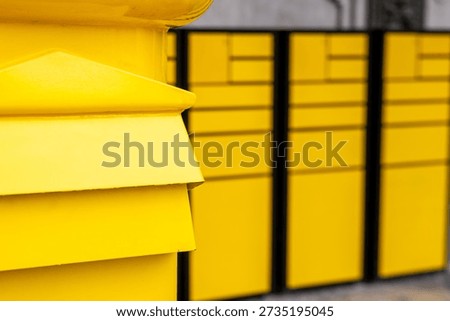 Yellow postboxes in Spain. Convenient collection of correspondence and packages. Close up