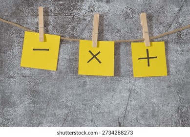 yellow post-it notes plus and minus signs