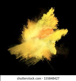 Yellow powder isolated on black background
