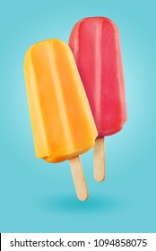 Yellow And Purple Popsicles Ice Cream Sticks On The Blue Background