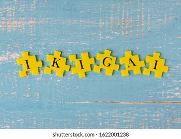 yellow puzzles with text IKIGAI on a blue background 