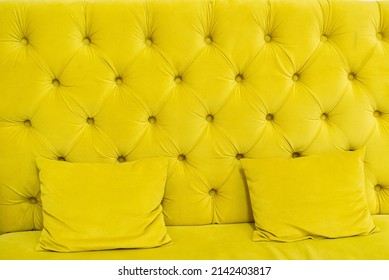 The Yellow Quilted Sofa With Yellow Soft Pillows