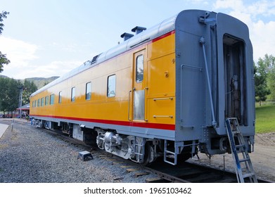 Yellow Railroad Dining Car Near Train Station