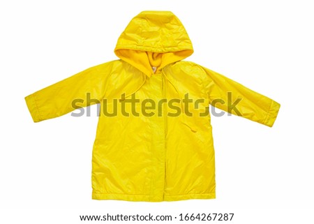 Yellow raincoat on white background isolated. Happy funny kids outwear autumn style clothes. Enjoying rainfall. Happy rainy day concept, Hello Fall greeting card copy space flat lay.Bright rain jacket