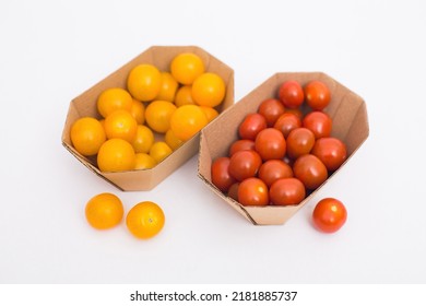 Yellow And Red Cherry Tomatoes In Crafty Eco-friendly Packaging. White Background. Minimalism. Cherry Tomatoes Isolated On White Background. Organic Cherry Tomatoes For Salad.