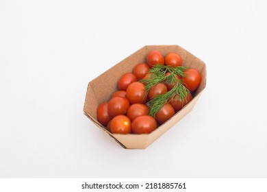 Yellow And Red Cherry Tomatoes In Crafty Eco-friendly Packaging. White Background. Minimalism. Cherry Tomatoes Isolated On White Background. Organic Cherry Tomatoes For Salad.