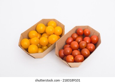 Yellow And Red Cherry Tomatoes In Crafty Eco-friendly Packaging. White Background. Minimalism. Cherry Tomatoes Isolated On White Background. Organic Cherry Tomatoes For Salad.