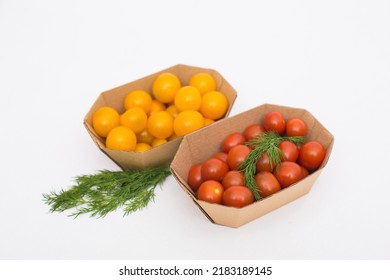 Yellow And Red Cherry Tomatoes In Crafty Eco-friendly Packaging. White Background. Minimalism. Cherry Tomatoes Isolated On White Background. Organic Cherry Tomatoes For Salad.