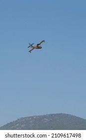 Yellow Red Firefighting Plane In Blue Sky