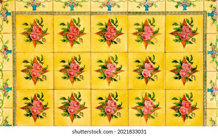 Yellow and red floral certamic tile mosaic, typical of those found on the facades of traditional Chinese Peranakan shop houses.