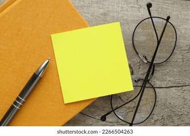 yellow reminder sticky note on a yellow notepad, empty space for text - Shutterstock ID 2266504263