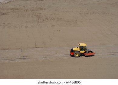 Yellow Roadroller, Steamroller On Yard Soil